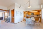 Dining table off kitchen features ocean views dreams are made of